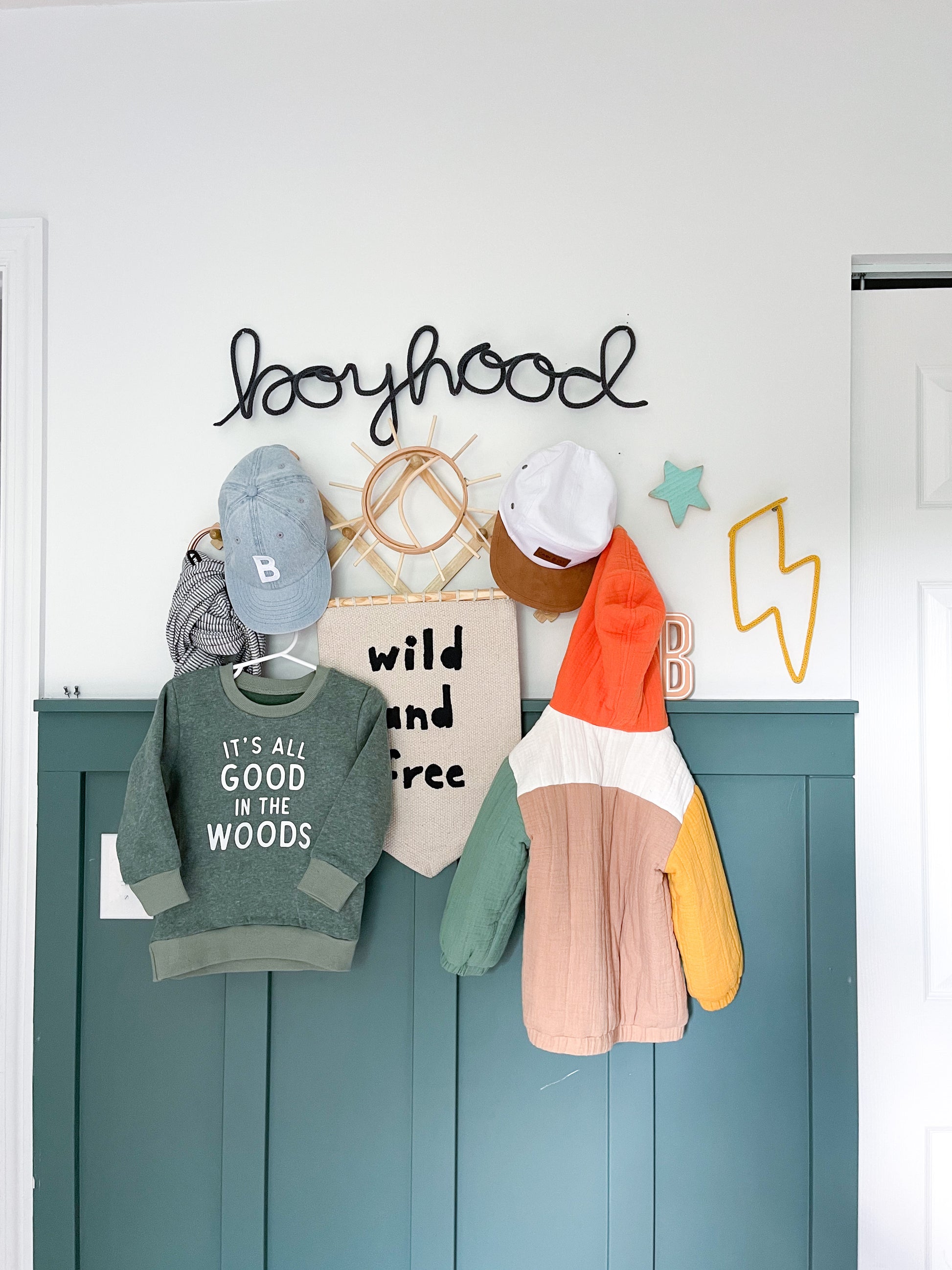 Knitted wire lightning bolt shape styled in little boy's room above accordion rack. 