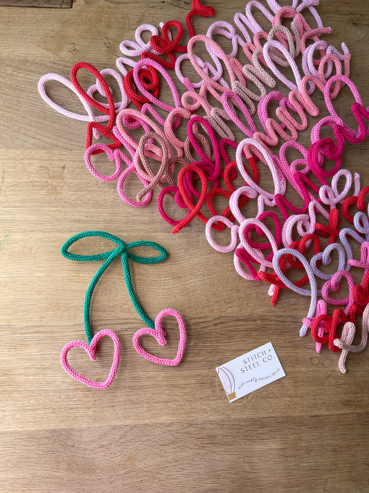 Knitted wire shaped heart cherries.